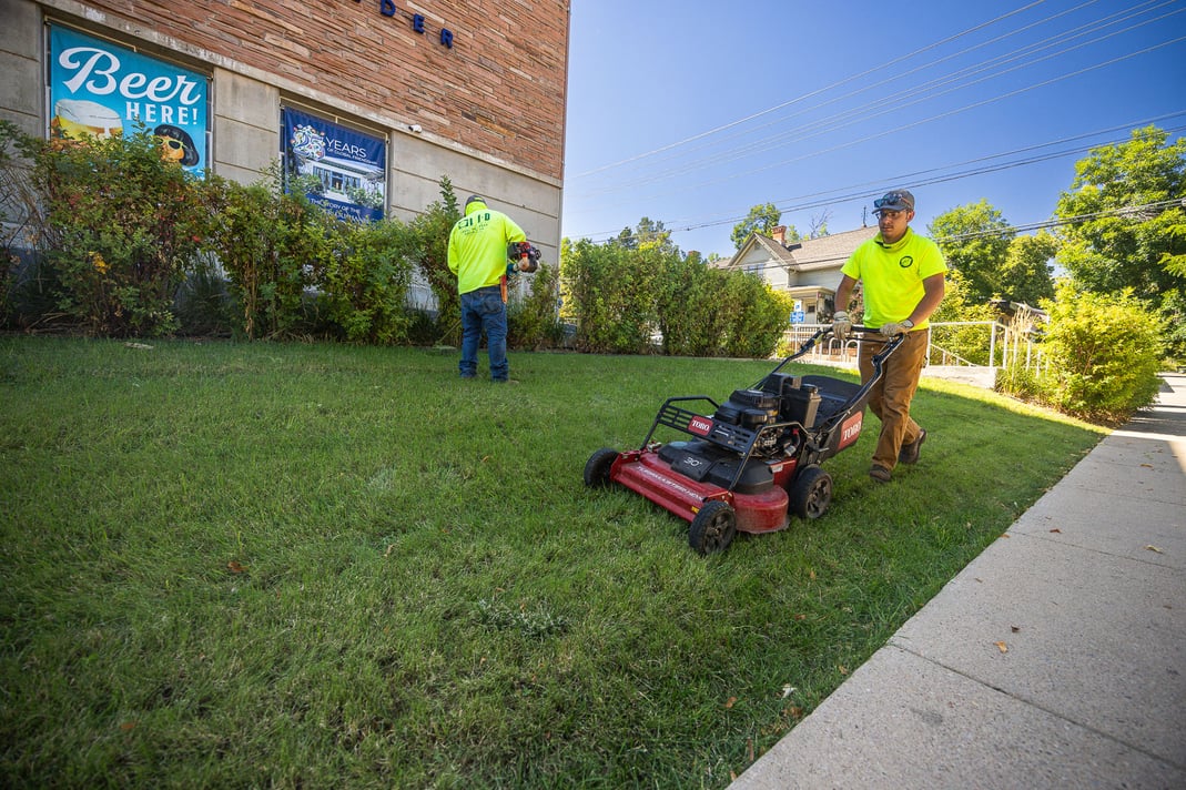 Commercial property maintenance mowing lawn and trimming