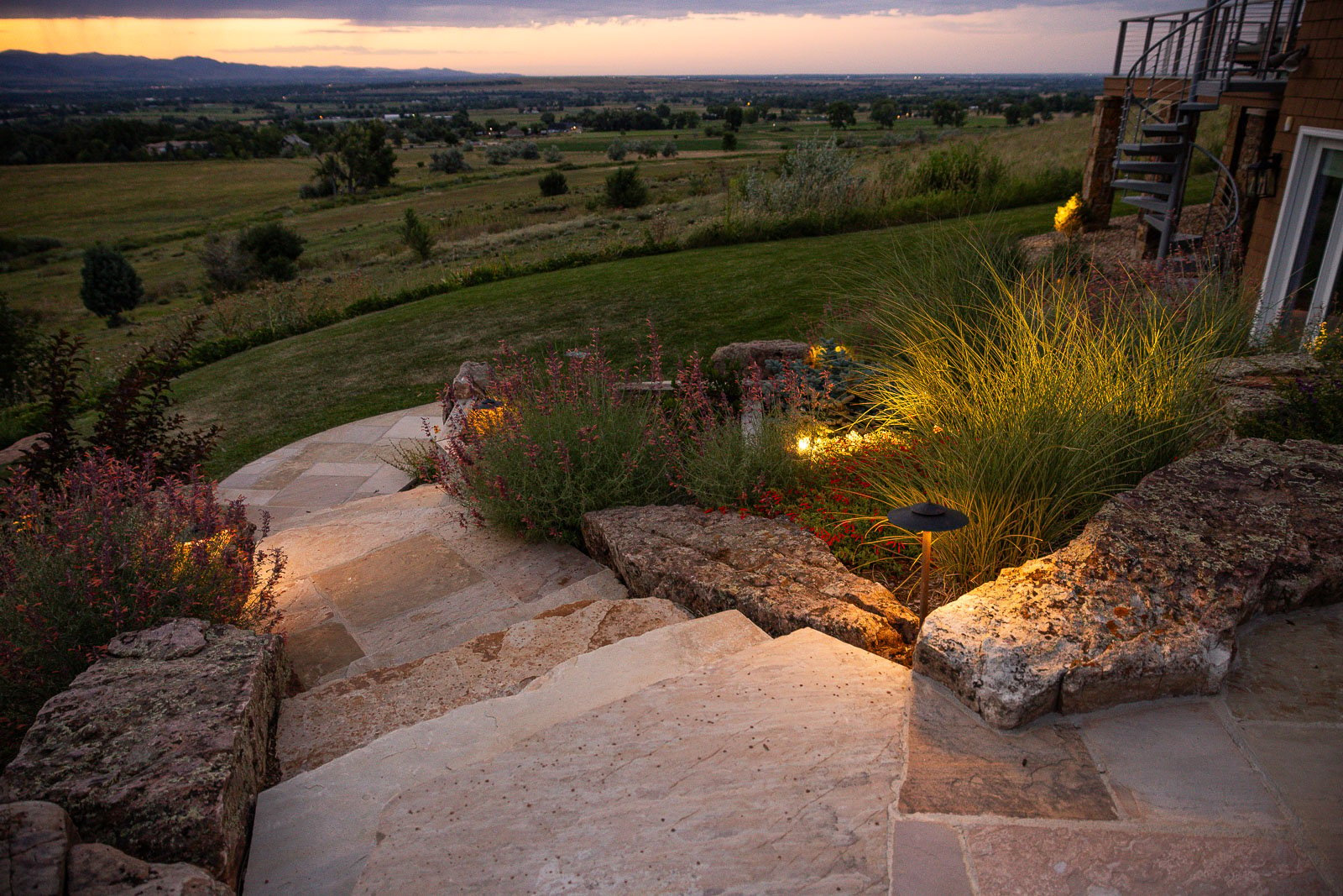 landscape lights accentuate a landscape and guide users down stone steps