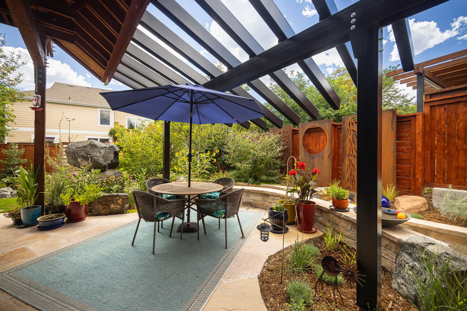 patio space with minimal plants and little grass