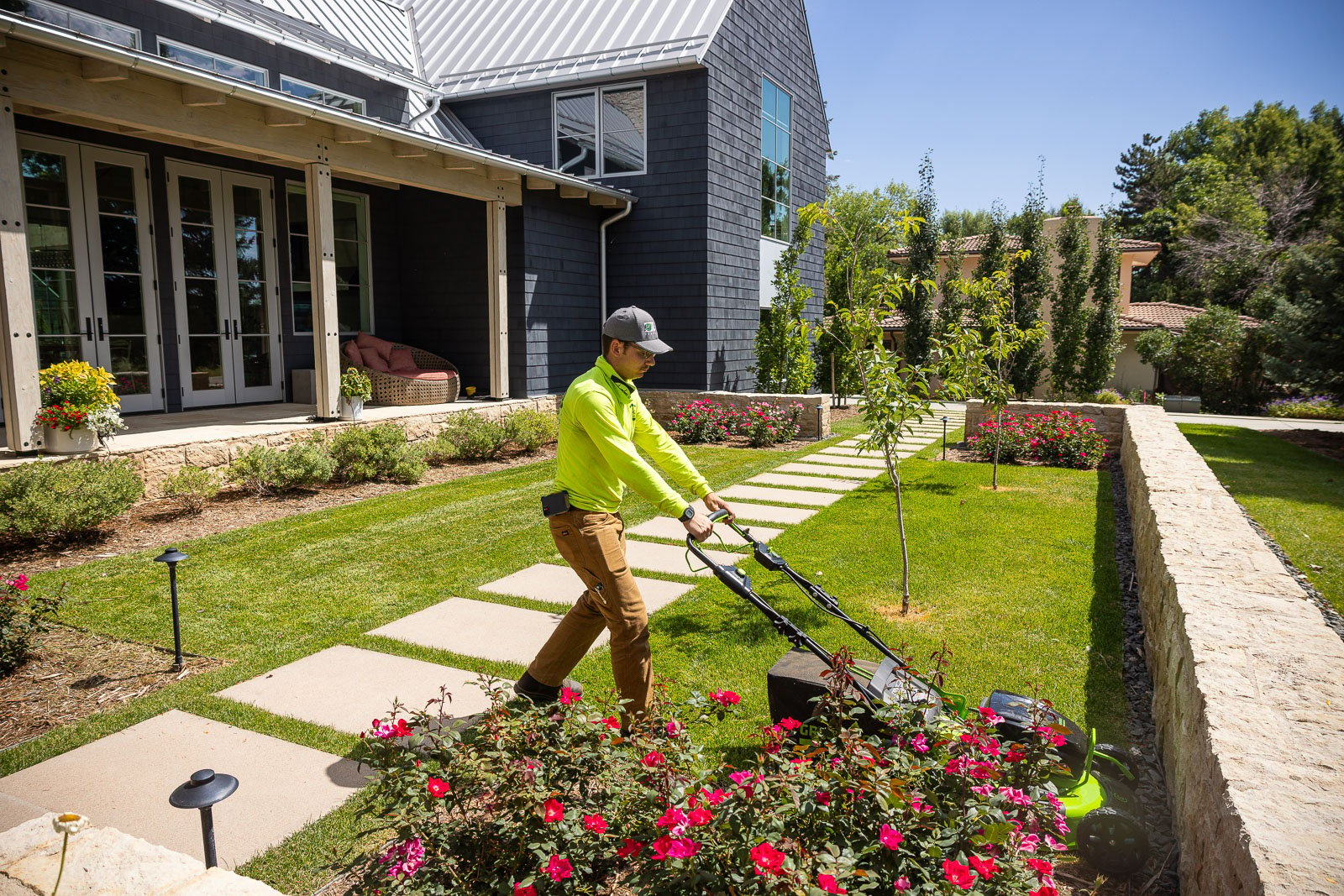 Residential landscape maintenance crew mowing 3