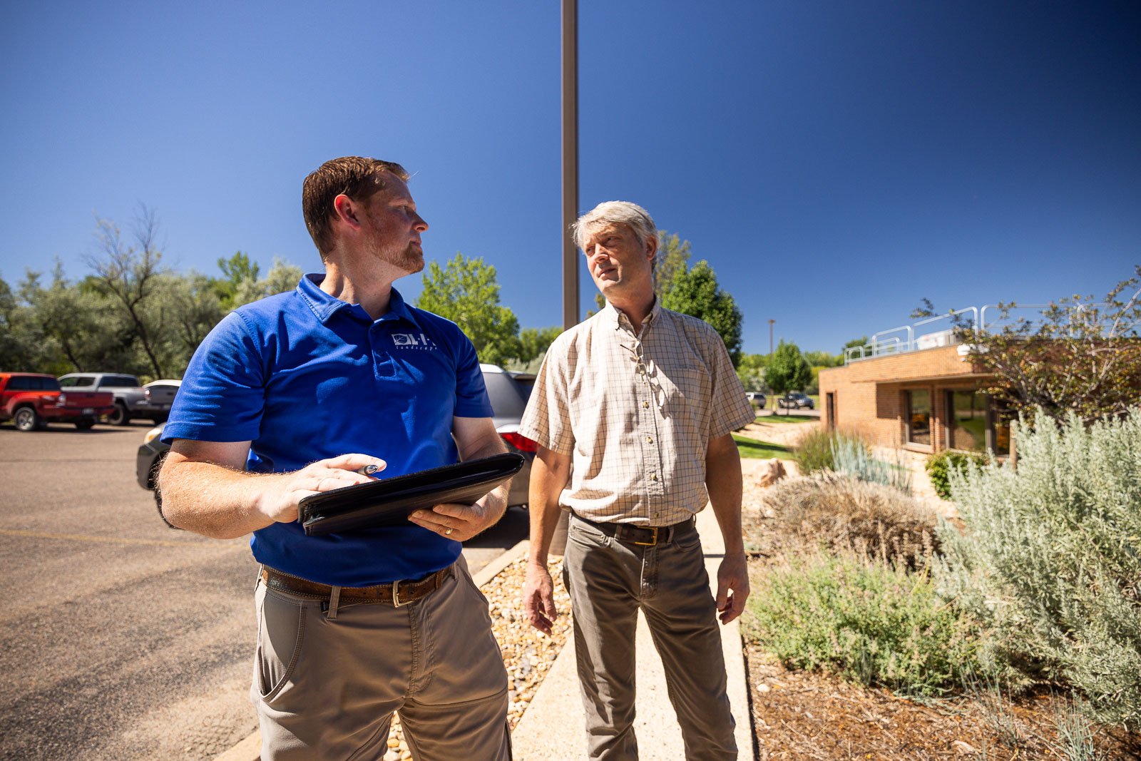 commercial account manager walking property with client property manager