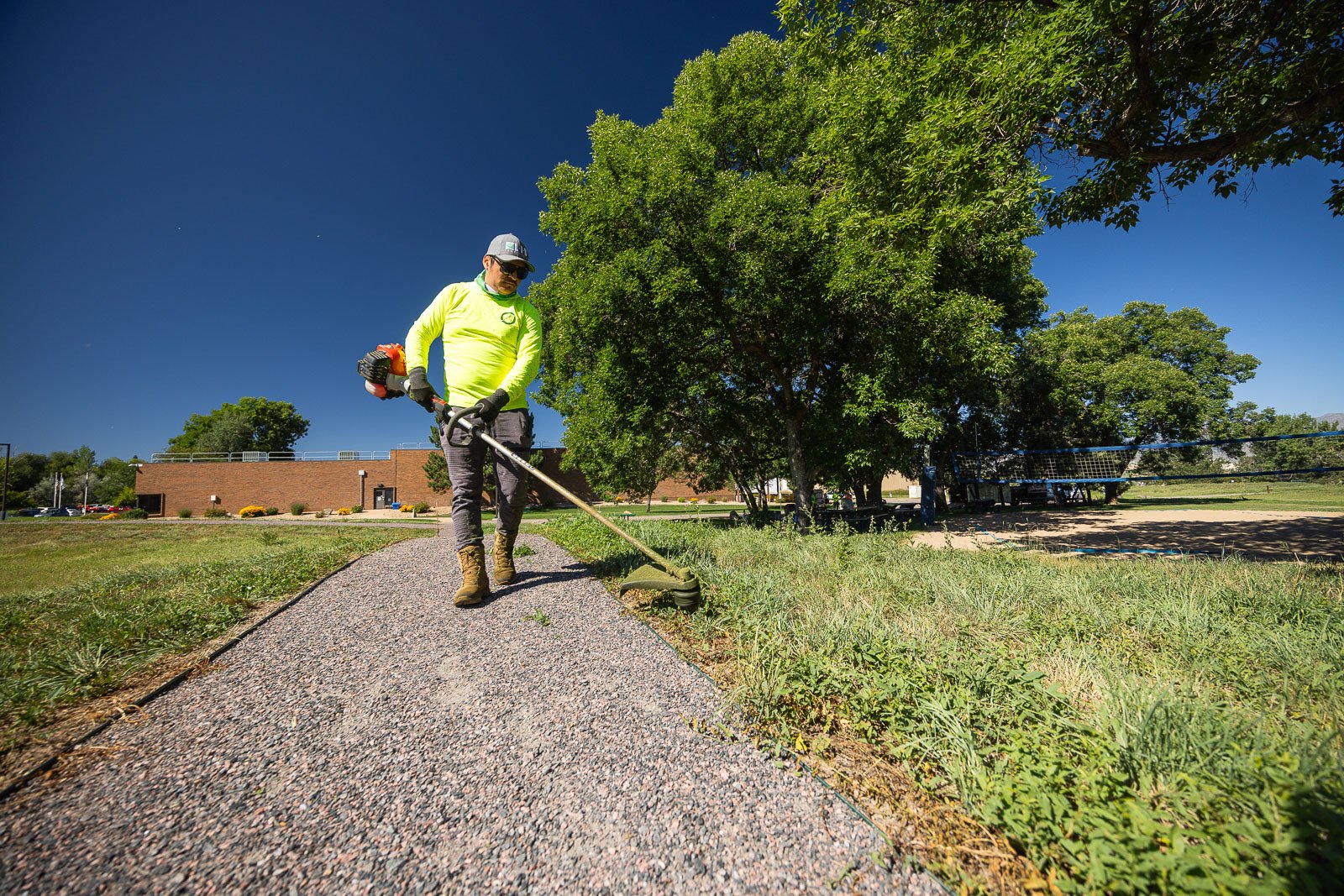 commercial maintenance crew lawn trimming 1