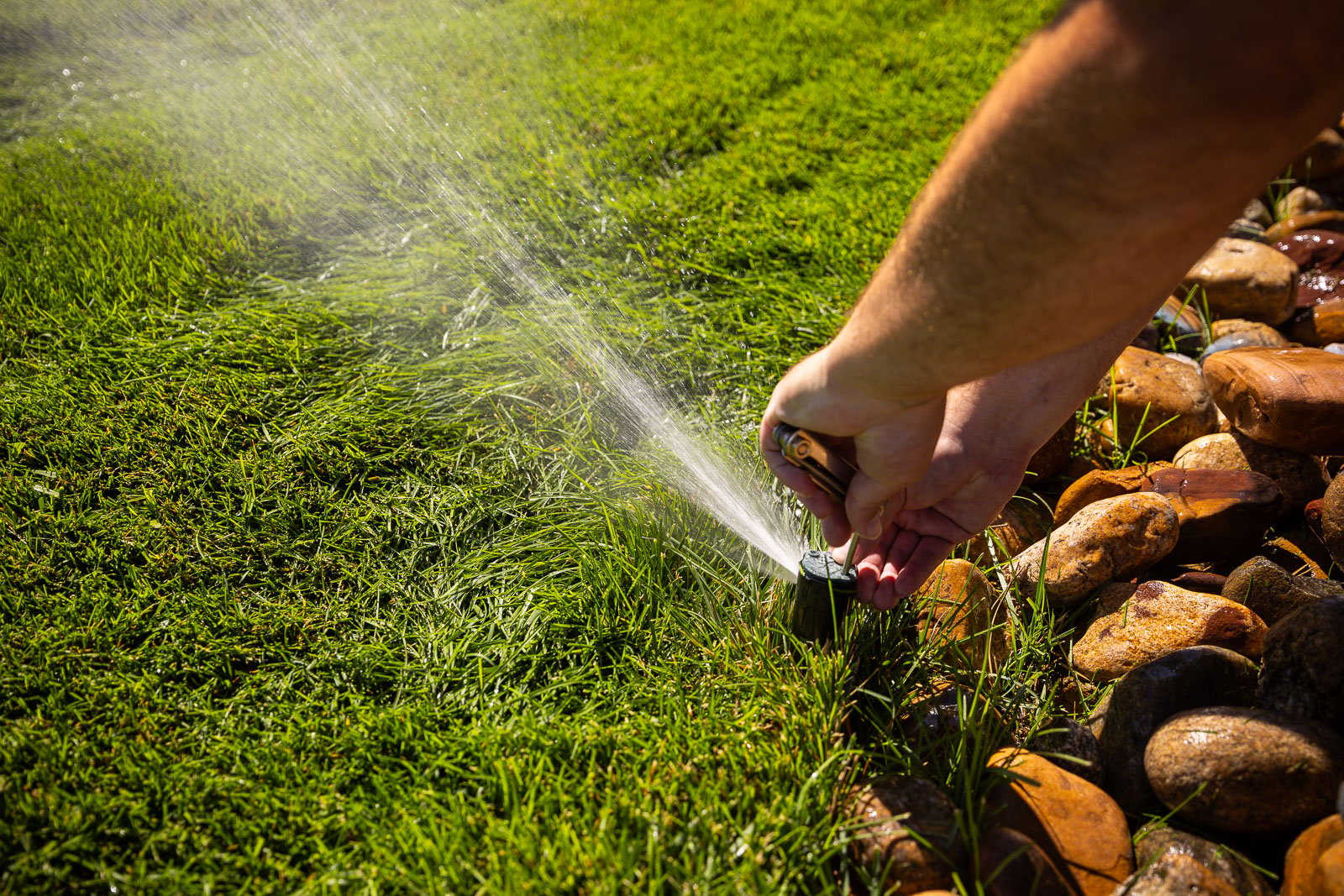 commercial maintenance irrigation system crew making adjustments 2