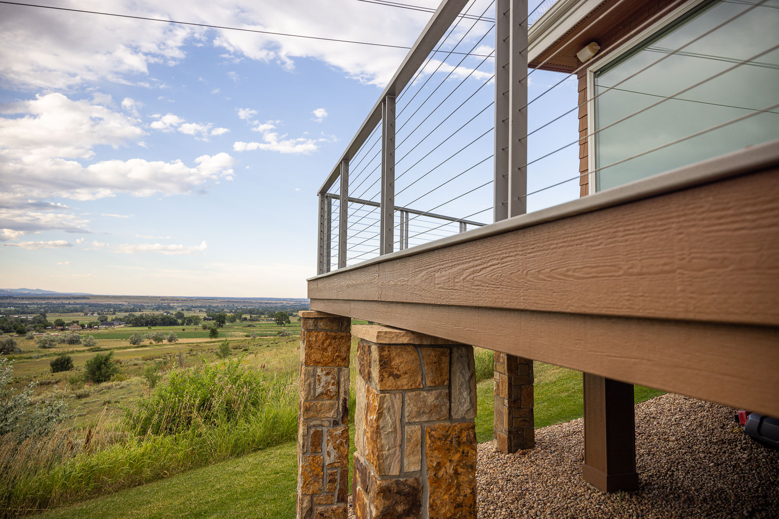 Residential landscape design back of house metal railing
