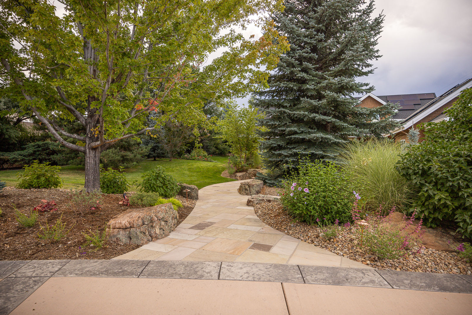 Residential landscape design walkway leading to house