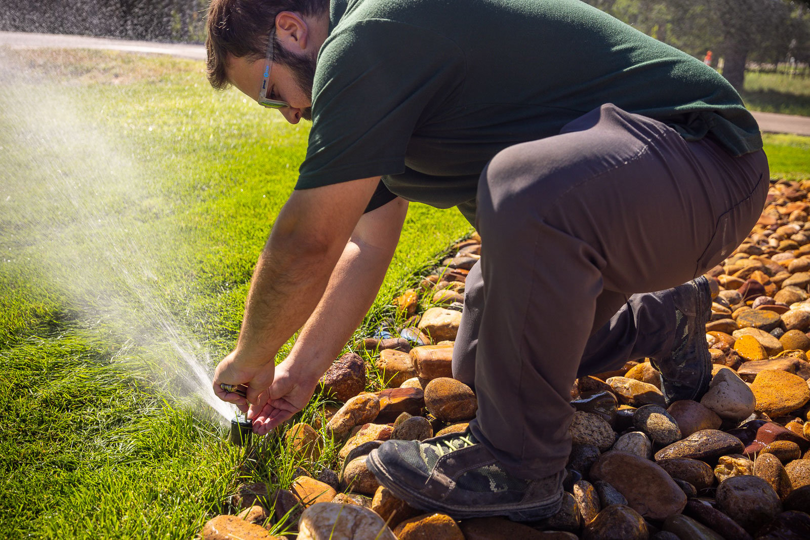 commercial maintenance irrigation system crew making adjustments 1