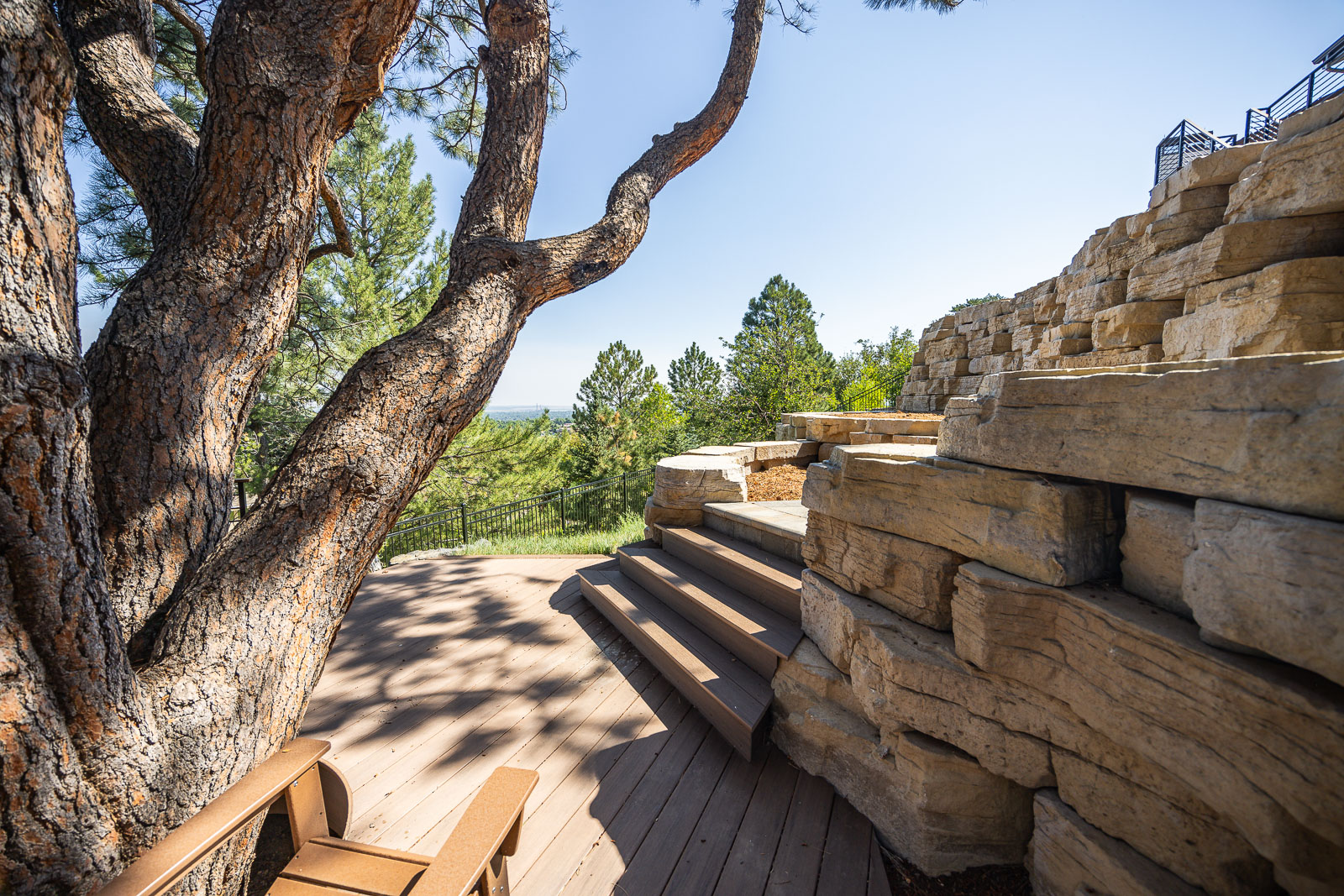 residential landscape design boulder retaining wall and steps 6
