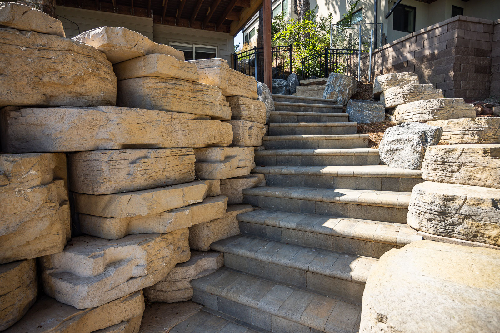 residential landscape design boulder retaining wall and steps 8